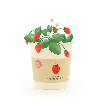 Becher von Die Stadtgärtner mit "Du bist unentbeerlich" Pflanzenbauset-Design, freigestellt auf weißem Hintergrund.