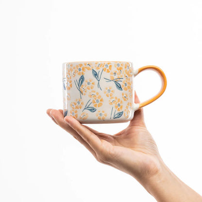 Handgefertigte VINTAGE GARDEN orange Steingut-Tasse von Tranquillo mit floralem Design, ideal für Kaffee oder Tee.